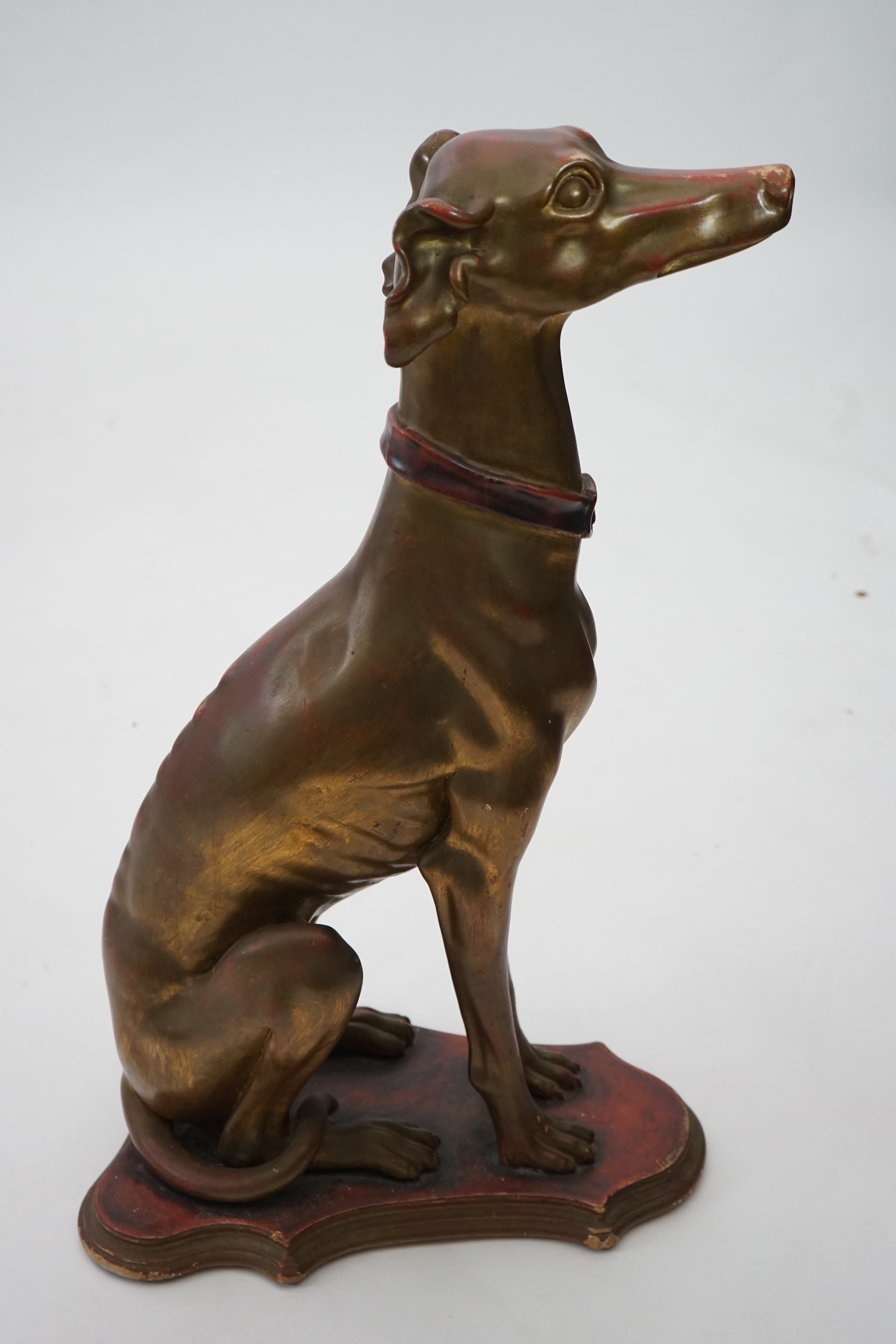 A 20th century Italian gilt and painted model of a seated Greyhound